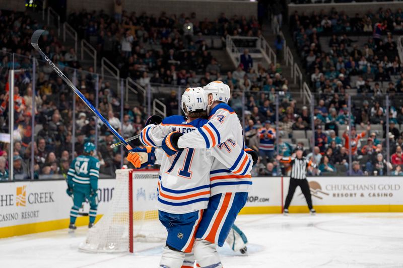 Dec 28, 2023; San Jose, California, USA; Edmonton Oilers center Ryan McLeod (71) andEdmonton Oilers defenseman Mattias Ekholm (14) celebrate after the goal against the San Jose Sharks during the first period at SAP Center at San Jose. Mandatory Credit: Neville E. Guard-USA TODAY Sports