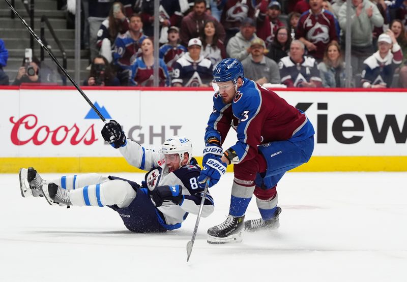 Apr 28, 2024; Denver, Colorado, USA; Winnipeg Jets defenseman Nate Schmidt (88) falls after defending Colorado Avalanche right wing Valeri Nichushkin (13) during the second period in game four of the first round of the 2024 Stanley Cup Playoffs at Ball Arena. Mandatory Credit: Ron Chenoy-USA TODAY Sports