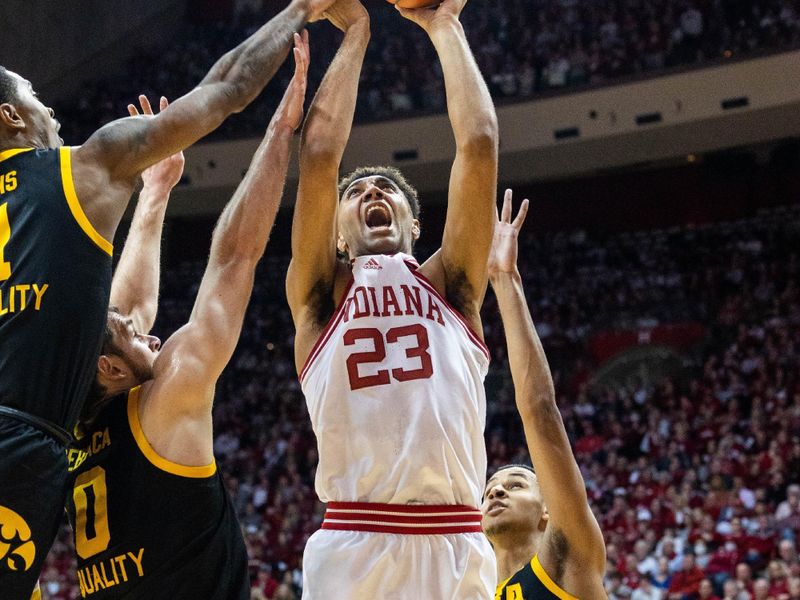 Feb 28, 2023; Bloomington, Indiana, USA; Indiana Hoosiers forward Trayce Jackson-Davis (23) shoots the ball while Iowa Hawkeyes defend in the first half at Simon Skjodt Assembly Hall. Mandatory Credit: Trevor Ruszkowski-USA TODAY Sports