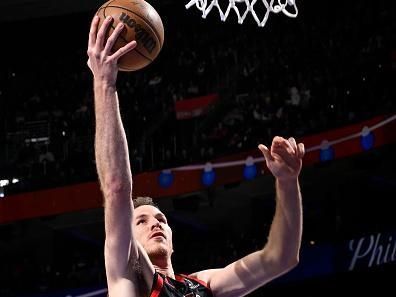 PHILADELPHIA, PA - DECEMBER 22:  Jakob Poeltl #19 of the Toronto Raptors drives to the basket during the game against the Philadelphia 76ers on December 22, 2023 at the Wells Fargo Center in Philadelphia, Pennsylvania NOTE TO USER: User expressly acknowledges and agrees that, by downloading and/or using this Photograph, user is consenting to the terms and conditions of the Getty Images License Agreement. Mandatory Copyright Notice: Copyright 2023 NBAE (Photo by David Dow/NBAE via Getty Images)