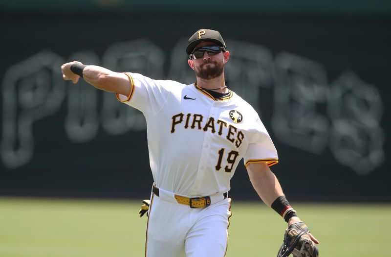 Aug 10, 2025; Pittsburgh, Pennsylvania, USA;  Pittsburgh Pirates shortstop Jared Triolo (19) warms up before the game against the Cincinnati Reds at PNC Park. Mandatory Credit: Charles LeClaire-Imagn Images