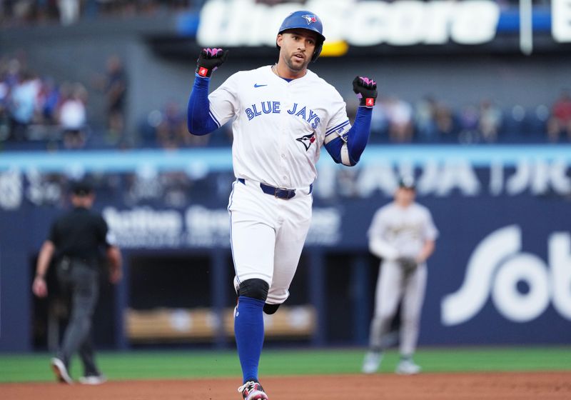 Aug 9, 2024; Toronto, Ontario, CAN; Toronto Blue Jays right fielder George Springer (4) runs the bases and celebrates after hitting a home run against the Oakland Athletics during the first inning at Rogers Centre. Mandatory Credit: Nick Turchiaro-USA TODAY Sports