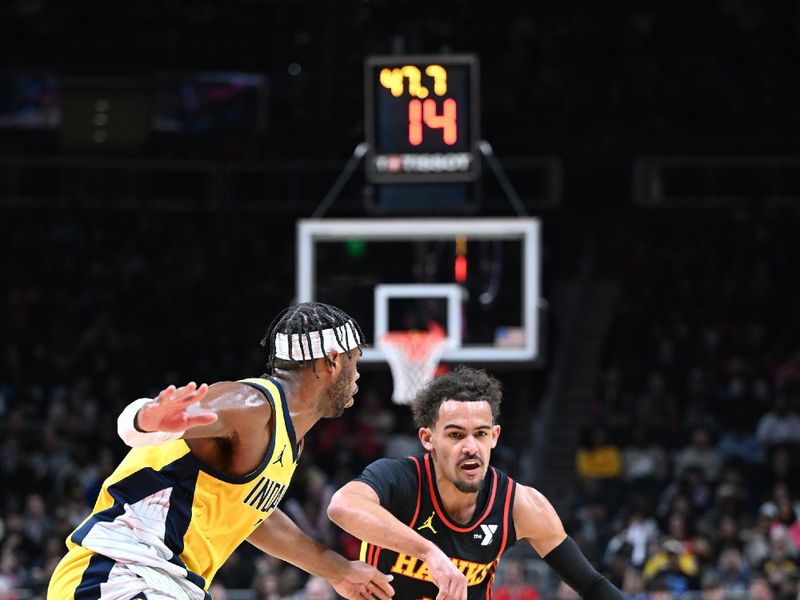 ATLANTA, GA - JANUARY 12: Trae Young #11 of the Atlanta Hawks dribbles the ball during the game against the Indiana Pacers on January 12, 2024 at State Farm Arena in Atlanta, Georgia.  NOTE TO USER: User expressly acknowledges and agrees that, by downloading and/or using this Photograph, user is consenting to the terms and conditions of the Getty Images License Agreement. Mandatory Copyright Notice: Copyright 2024 NBAE (Photo by Adam Hagy/NBAE via Getty Images)