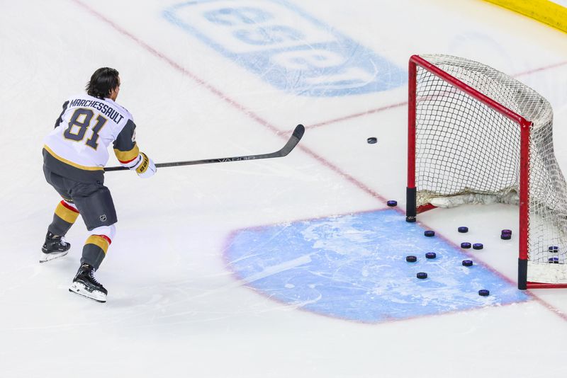 Mar 14, 2024; Calgary, Alberta, CAN; Vegas Golden Knights right wing Jonathan Marchessault (81) shoots packs on the net during the warmup period against the Calgary Flames at Scotiabank Saddledome. Mandatory Credit: Sergei Belski-USA TODAY Sports