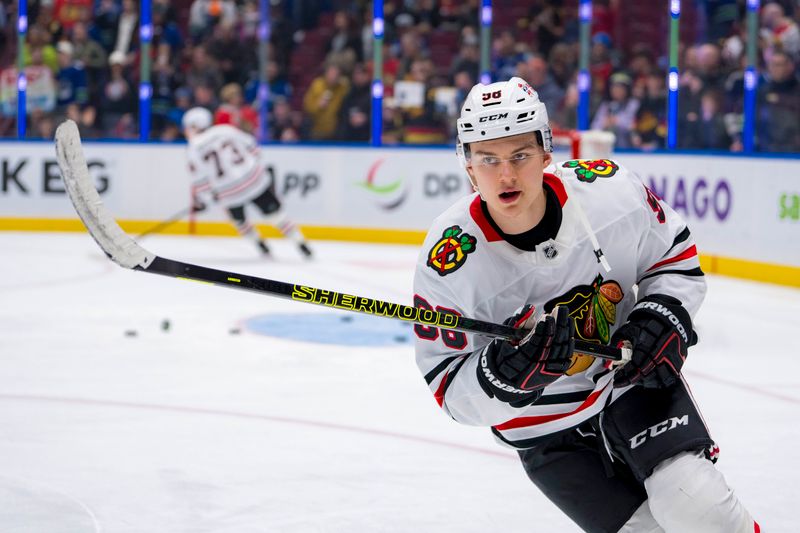 Nov 16, 2024; Vancouver, British Columbia, CAN; Chicago Blackhawks forward Connor Bedard (98) skates during warm up prior to a game against the Vancouver Canucks at Rogers Arena. Mandatory Credit: Bob Frid-Imagn Images