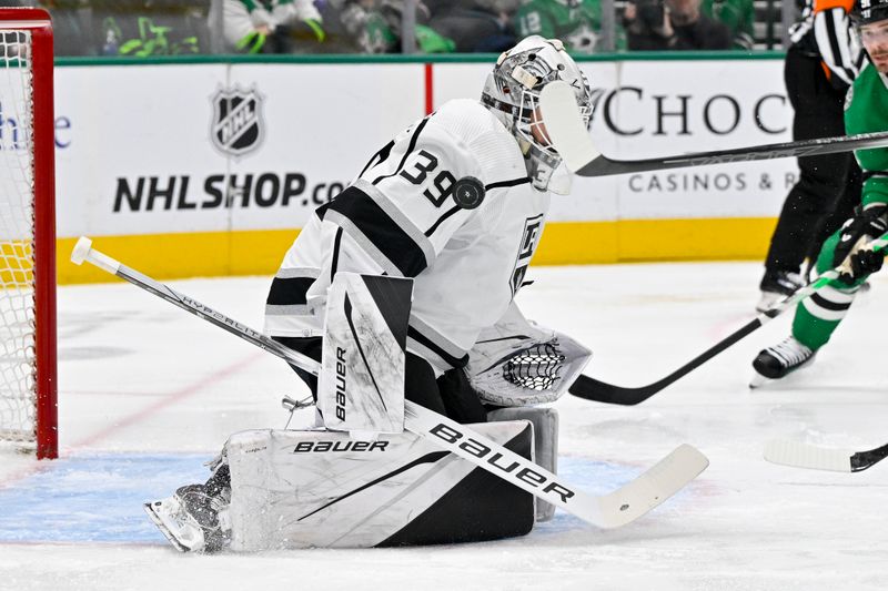 Jan 16, 2024; Dallas, Texas, USA; Los Angeles Kings goaltender Cam Talbot (39) stops a shot by Dallas Stars left wing Mason Marchment (27) during the second period at the American Airlines Center. Mandatory Credit: Jerome Miron-USA TODAY Sports