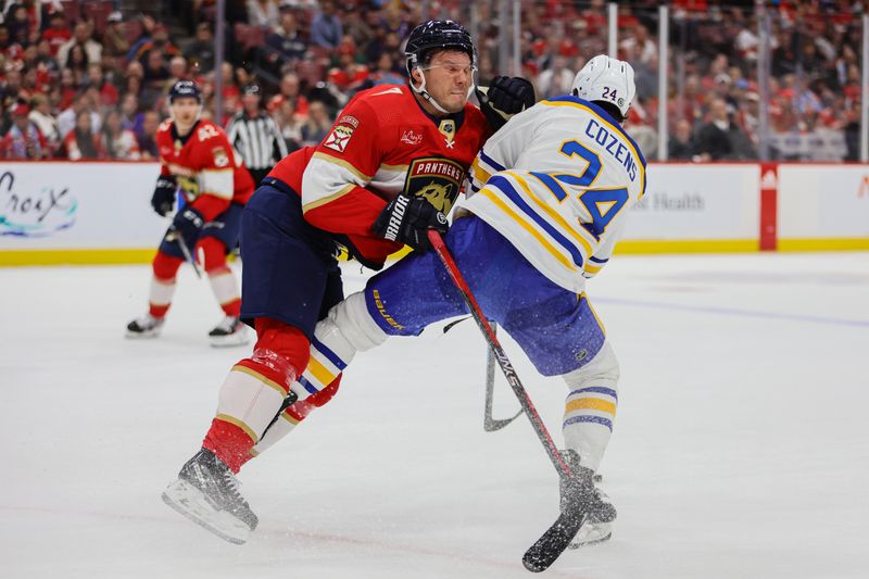 Apr 13, 2024; Sunrise, Florida, USA; Florida Panthers defenseman Dmitry Kulikov (7) and Buffalo Sabres center Dylan Cozens (24) collide during the first period at Amerant Bank Arena. Mandatory Credit: Sam Navarro-USA TODAY Sports