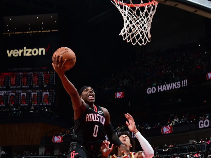 ATLANTA, GA - FEBRUARY 10: Aaron Holiday #0 of the Houston Rockets drives to the basket during the game against the Atlanta Hawks on February 10, 2024 at State Farm Arena in Atlanta, Georgia.  NOTE TO USER: User expressly acknowledges and agrees that, by downloading and/or using this Photograph, user is consenting to the terms and conditions of the Getty Images License Agreement. Mandatory Copyright Notice: Copyright 2024 NBAE (Photo by Scott Cunningham/NBAE via Getty Images)