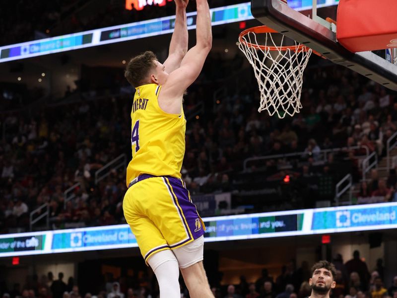 CLEVELAND, OH - OCTOBER 30:  Dalton Knecht #4 of the Los Angeles Lakers dunks the ball during the game against the Cleveland Cavaliers on October 30, 2024 at Rocket Mortgage FieldHouse in Cleveland, Ohio. NOTE TO USER: User expressly acknowledges and agrees that, by downloading and/or using this Photograph, user is consenting to the terms and conditions of the Getty Images License Agreement. Mandatory Copyright Notice: Copyright 2024 NBAE (Photo by  Lauren Leigh Bacho/NBAE via Getty Images)