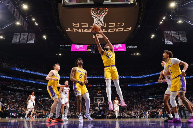 PHOENIX, AZ - OCTOBER 17: Armel Traore #94 of the Los Angeles Lakers goes up for the rebound during the game against the Phoenix Suns during a NBA Preseason game on October 17, 2024 at Footprint Center in Phoenix, Arizona. NOTE TO USER: User expressly acknowledges and agrees that, by downloading and or using this photograph, user is consenting to the terms and conditions of the Getty Images License Agreement. Mandatory Copyright Notice: Copyright 2024 NBAE (Photo by Barry Gossage/NBAE via Getty Images)