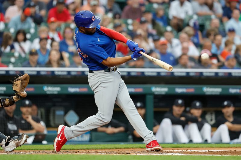 Aug 23, 2023; Detroit, Michigan, USA;  Chicago Cubs first baseman Jeimer Candelario (9) hits an RBI double at Comerica Park. Mandatory Credit: Rick Osentoski-USA TODAY Sports