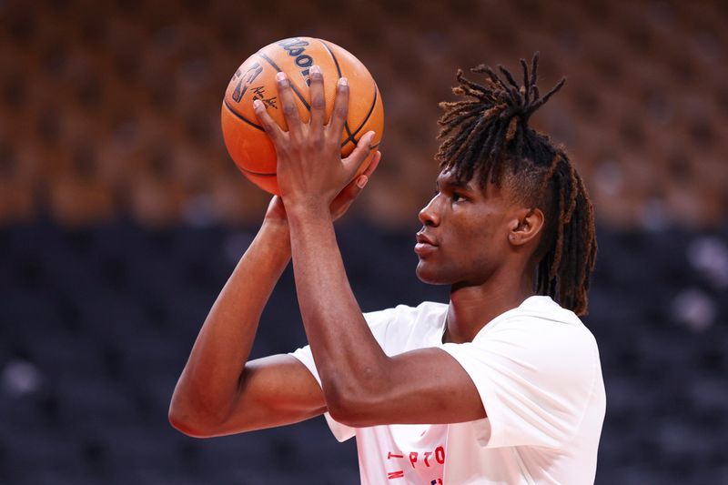 TORONTO, CANADA - NOVEMBER 1: Ja'Kobe Walter #14 of the Toronto Raptors warms up before the game against the Los Angeles Lakers on November 1, 2024 at the Scotiabank Arena in Toronto, Ontario, Canada.  NOTE TO USER: User expressly acknowledges and agrees that, by downloading and or using this Photograph, user is consenting to the terms and conditions of the Getty Images License Agreement.  Mandatory Copyright Notice: Copyright 2024 NBAE (Photo by Vaughn Ridley/NBAE via Getty Images)