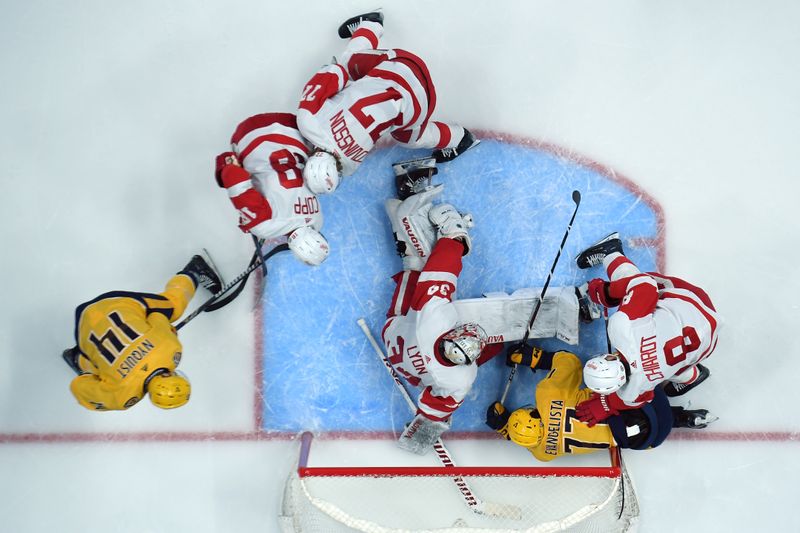 Mar 23, 2024; Nashville, Tennessee, USA; Detroit Red Wings goaltender Alex Lyon (34) makes a save in traffic during the second period against the Nashville Predators at Bridgestone Arena. Mandatory Credit: Christopher Hanewinckel-USA TODAY Sports