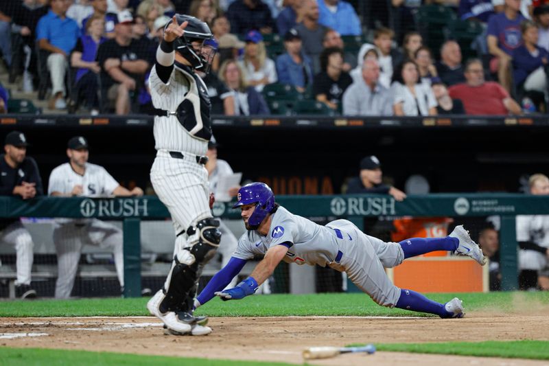 Aug 9, 2024; Chicago, Illinois, USA; Chicago Cubs shortstop Dansby Swanson (7) scores against the Chicago White Sox during the third inning at Guaranteed Rate Field. Mandatory Credit: Kamil Krzaczynski-USA TODAY Sports