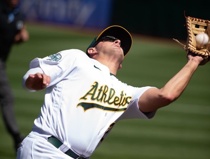 Sep 6, 2023; Oakland, California, USA; Oakland Athletics first baseman Jonah Bride (26) makes the catch of a foul popup by Toronto Blue Jays designated hitter George Springer during the fourth inning at Oakland-Alameda County Coliseum. Mandatory Credit: D. Ross Cameron-USA TODAY Sports