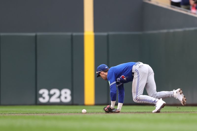 Oct 4, 2023; Minneapolis, Minnesota, USA; Toronto Blue Jays second baseman Cavan Biggio (8) is unable to field the ball in the fourth inning against the Minnesota Twins during game two of the Wildcard series for the 2023 MLB playoffs at Target Field. Mandatory Credit: Jesse Johnson-USA TODAY Sports