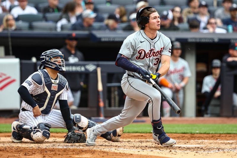 May 4, 2024; Bronx, New York, USA;  Detroit Tigers second baseman Colt Keith (33) hits an RBI sacrifice fly in the fourth inning against the New York Yankees at Yankee Stadium. Mandatory Credit: Wendell Cruz-USA TODAY Sports