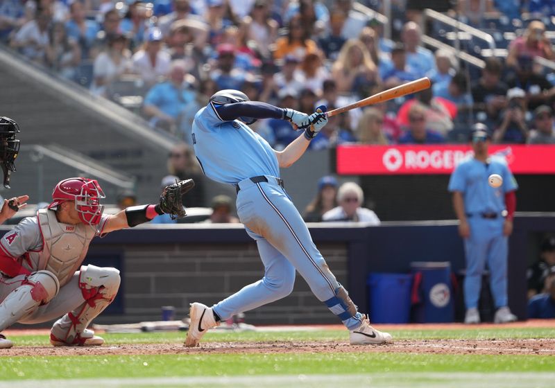 Aug 25, 2024; Toronto, Ontario, CAN; Toronto Blue Jays center fielder Joey Loperfido (9) gets on first base on fielders choice scoring a run against the Los Angeles Angels during the eighth inning at Rogers Centre. Mandatory Credit: Nick Turchiaro-USA TODAY Sports