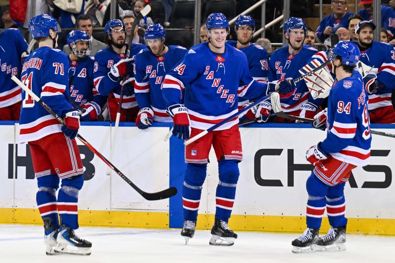 Oct 2, 2025; New York, New York, USA;  New York Rangers center Adam Edstrom (84) celebrates his goal with right wing Gabe Perreault (94) and center Juuso Parssinen (71) against the New Jersey Devils during the second period at Madison Square Garden. Mandatory Credit: Dennis Schneidler-Imagn Images