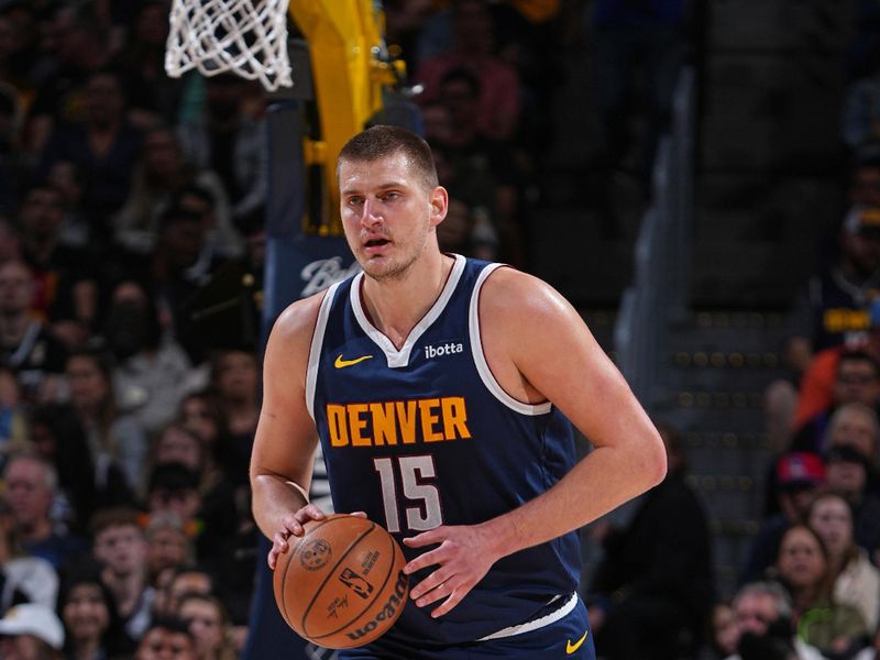 DENVER, CO - MARCH 31: Nikola Jokic #15 of the Denver Nuggets brings the ball up court during the game against the Cleveland Cavaliers on March 31, 2024 at the Ball Arena in Denver, Colorado. NOTE TO USER: User expressly acknowledges and agrees that, by downloading and/or using this Photograph, user is consenting to the terms and conditions of the Getty Images License Agreement. Mandatory Copyright Notice: Copyright 2024 NBAE (Photo by Garrett Ellwood/NBAE via Getty Images)