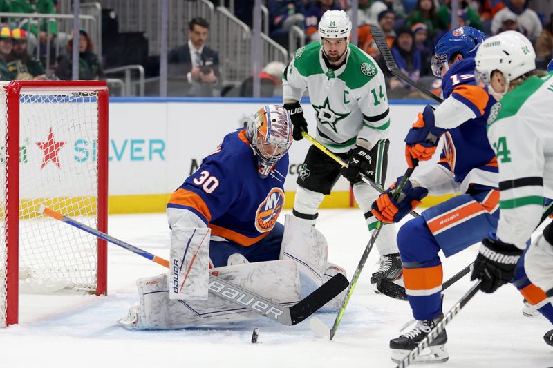 Jan 21, 2024; Elmont, New York, USA; New York Islanders goaltender Ilya Sorokin (30) plays the puck against Dallas Stars left wing Jamie Benn (14) during the first period at UBS Arena. Mandatory Credit: Brad Penner-USA TODAY Sports