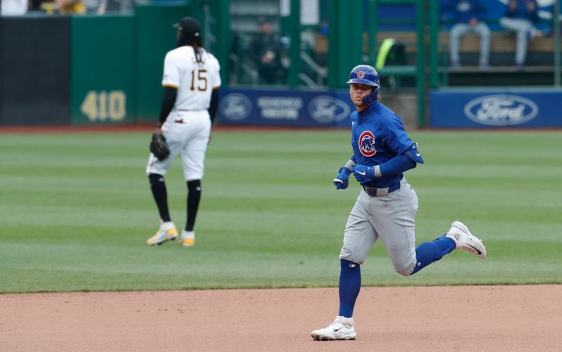 May 11, 2024; Pittsburgh, Pennsylvania, USA;  Chicago Cubs shortstop Nico Hoerner (2) circles the bases on a solo home run against the Pittsburgh Pirates during the fourth inning at PNC Park. Mandatory Credit: Charles LeClaire-USA TODAY Sports