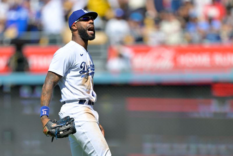 Sep 3, 2023; Los Angeles, California, USA;  Los Angeles Dodgers right fielder Jason Heyward (23) reacts after making a sliding catch off a ball hit by Atlanta Braves second baseman Ozzie Albies (1) in the sixth inning at Dodger Stadium. Mandatory Credit: Jayne Kamin-Oncea-USA TODAY Sports