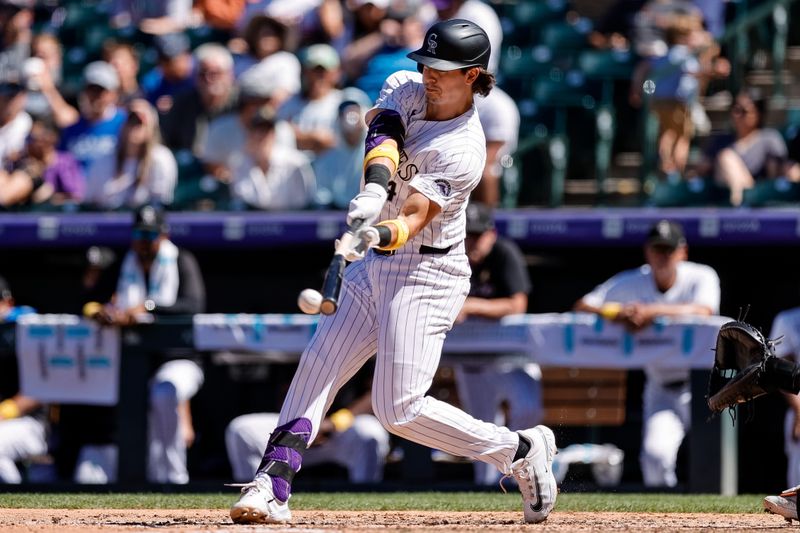 Sep 1, 2024; Denver, Colorado, USA; Colorado Rockies first baseman Michael Toglia (4) bats in the fifth inning against the Baltimore Orioles at Coors Field. Mandatory Credit: Isaiah J. Downing-USA TODAY Sports