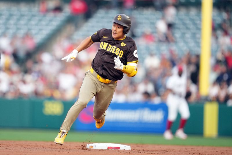 Jun 3, 2024; Anaheim, California, USA; San Diego Padres shortstop Ha-Seong Kim (7) rounds second base on a double in the second inning against the Los Angeles Angels at Angel Stadium. Mandatory Credit: Kirby Lee-USA TODAY Sports