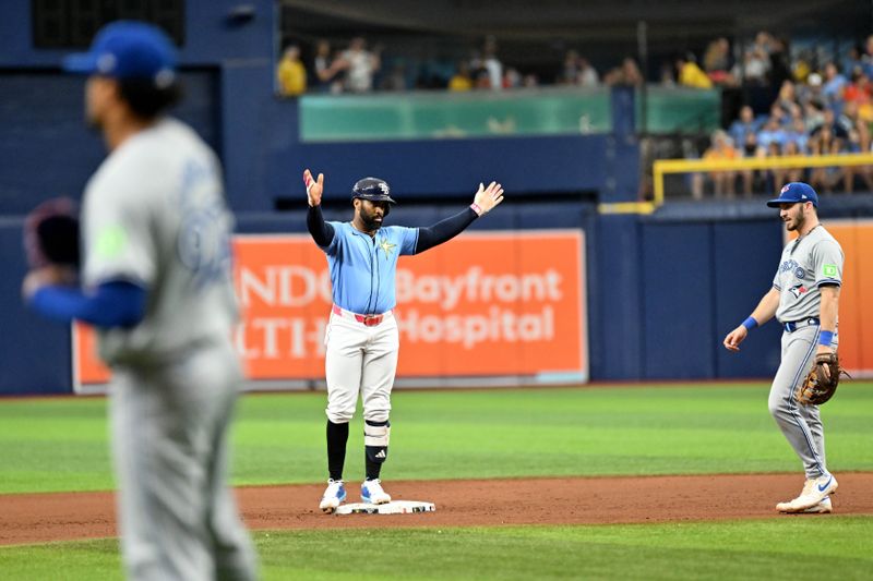 Sep 22, 2024; St. Petersburg, Florida, USA; Tampa Bay Rays pinch hitter Yandy Diaz (2) reacts after hitting a double in the seventh inning against the Toronto Blue Jays at Tropicana Field. Mandatory Credit: Jonathan Dyer-Imagn Images