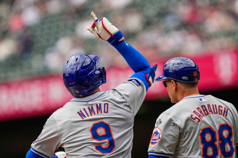 Apr 11, 2024; Cumberland, Georgia, USA; New York Mets left fielder Brandon Nimmo (9) reacts after hitting a triple to drive in a run against the Atlanta Braves during the eighth inning at Truist Park. Mandatory Credit: Dale Zanine-USA TODAY Sports