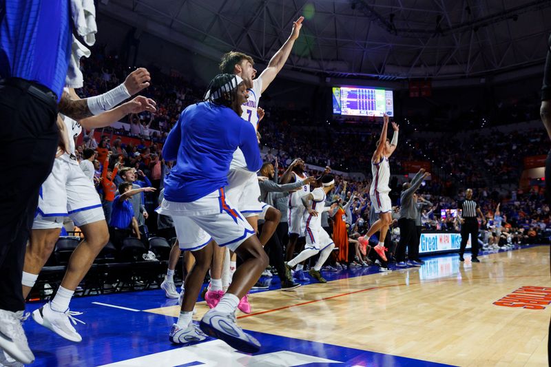 Mar 3, 2026; Gainesville, Florida, USA; Florida Gators guard Xaivian Lee (1), guard Urban Klavzar (7), forward Thomas Haugh (10), forward Alex Condon (21), guard AJ Brown (23), center Micah Handlogten (3) and center Rueben Chinyelu (9) react after a teammate’s first basketball against the Mississippi State Bulldogs during the second half at Exactech Arena at the Stephen C. O'Connell Center. Mandatory Credit: Morgan Tencza-Imagn Images