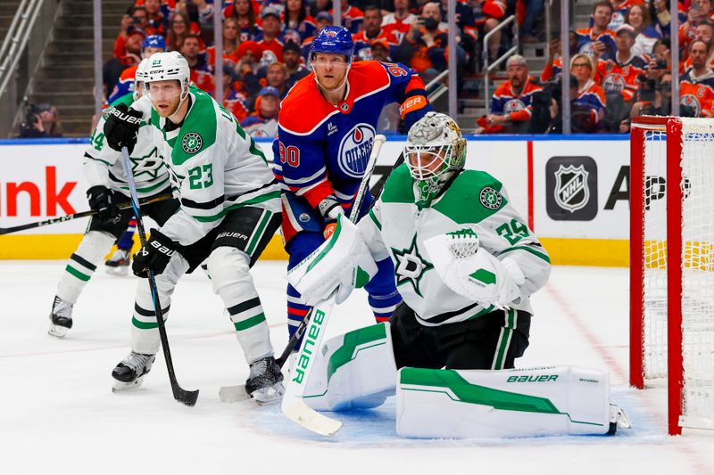 May 27, 2025; Edmonton, Alberta, CAN; Edmonton Oilers right wing Corey Perry (90) skates between Dallas Stars defenseman Esa Lindell (23) and goaltender Jake Oettinger (29) during the third period in game four of the Western Conference Final of the 2025 Stanley Cup Playoffs at Rogers Place. Mandatory Credit: Perry Nelson-Imagn Images