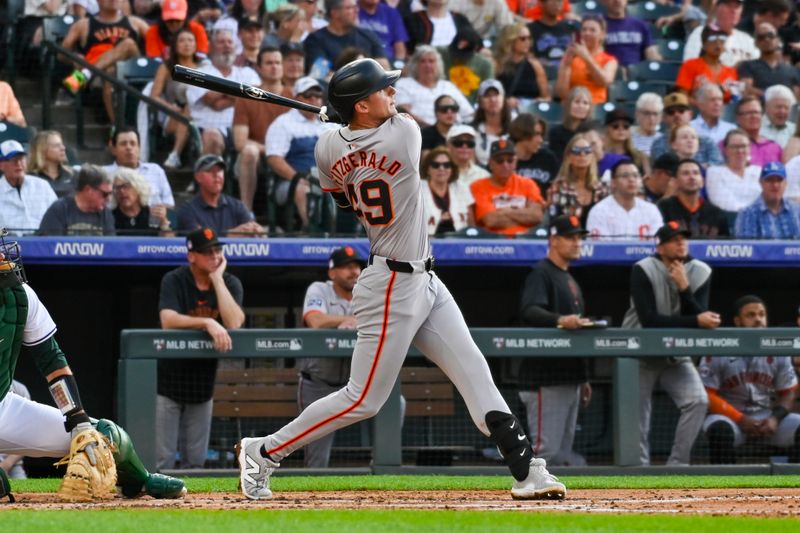 Jul 20, 2024; Denver, Colorado, USA; San Francisco Giants outfielder Tyler Fitzgerald (49) hits a home run against the Colorado Rockies in the third inning at Coors Field. Mandatory Credit: John Leyba-USA TODAY Sports