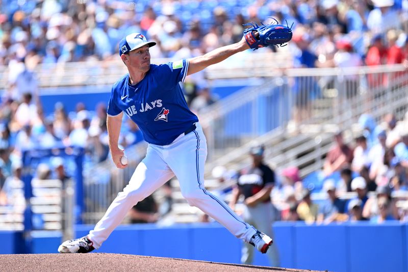 Mar 11, 2025; Dunedin, Florida, USA; Toronto Blue Jays starting pitcher Chris Bassitt (40) throws a pitch in the first inning against the Minnesota Twins during spring training  at TD Ballpark. Mandatory Credit: Jonathan Dyer-Imagn Images