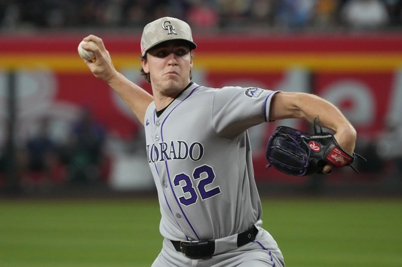 May 18, 2025; Phoenix, Arizona, USA; Colorado Rockies pitcher Chase Dollander (32) throws against the Arizona Diamondbacks in the first inning at Chase Field. Mandatory Credit: Rick Scuteri-Imagn Images
