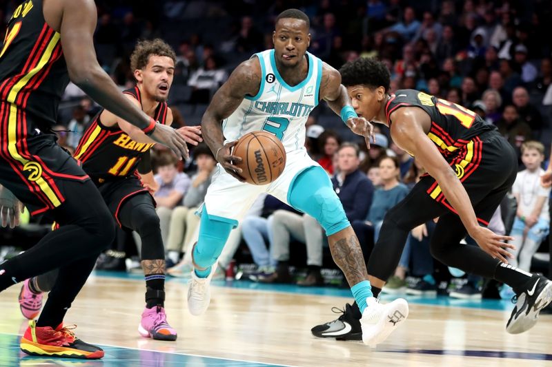 CHARLOTTE, NORTH CAROLINA - FEBRUARY 13: Terry Rozier #3 of the Charlotte Hornets drives to the basket during the first period of a basketball game against the Atlanta Hawks at Spectrum Center on February 13, 2023 in Charlotte, North Carolina. NOTE TO USER: User expressly acknowledges and agrees that, by downloading and or using this photograph, User is consenting to the terms and conditions of the Getty Images License Agreement. (Photo by David Jensen/Getty Images)