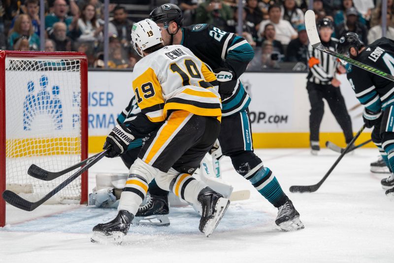 Oct 18, 2025; San Jose, California, USA; San Jose Sharks defenseman Vincent Iorio (22) and Pittsburgh Penguins center Connor Dewar (19) battle for position in front of the net during first perioid at SAP Center at San Jose. Mandatory Credit: Neville E. Guard-Imagn Images