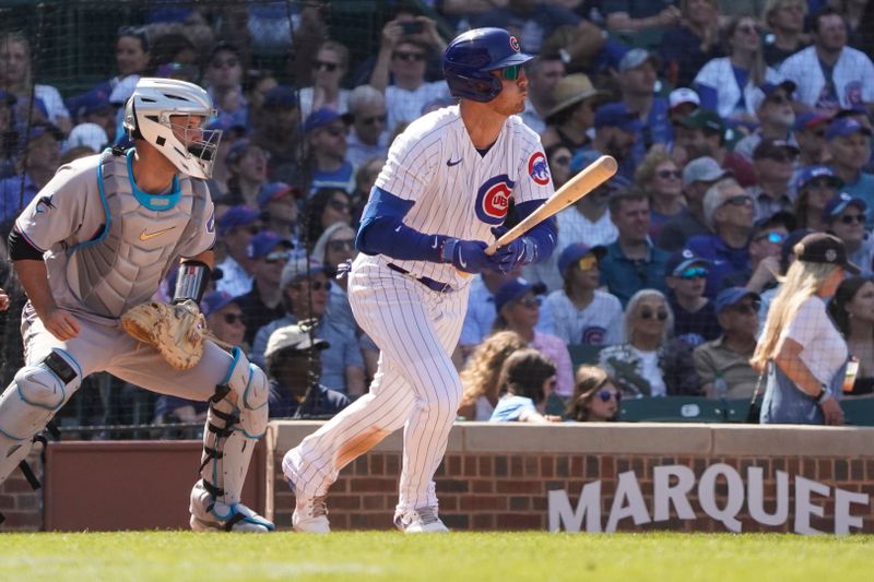 May 7, 2023; Chicago, Illinois, USA; Chicago Cubs center fielder Cody Bellinger (24) hits a one run double during the ninth inning against the Miami Marlins at Wrigley Field. Mandatory Credit: David Banks-USA TODAY Sports