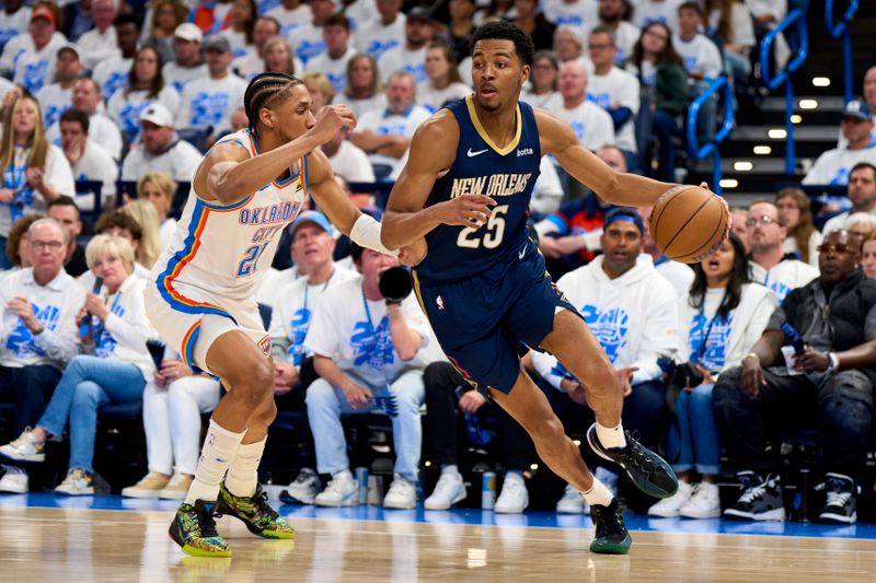 OKLAHOMA CITY, OKLAHOMA - APRIL 21: Trey Murphy III #25 of the New Orleans Pelicans drives to the basket against Aaron Wiggins #21 of the Oklahoma City Thunder during the second half in game one of the Western Conference First Round Playoffs at the Paycom Center on April 21, 2024 in Oklahoma City, Oklahoma. NOTE TO USER: User expressly acknowledges and agrees that, by downloading and or using this photograph, User is consenting to the terms and conditions of the Getty Images License Agreement. (Photo by Cooper Neill/Getty Images)