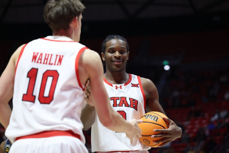 Mar 4, 2025; Salt Lake City, Utah, USA; Utah Utes forward Ezra Ausar (2) reacts to a play with forward Jake Wahlin (10) during the first half of the game against the West Virginia Mountaineers at Jon M. Huntsman Center. Mandatory Credit: Rob Gray-Imagn Images