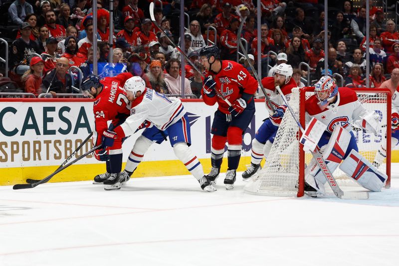 Oct 31, 2024; Washington, District of Columbia, USA; Washington Capitals center Connor McMichael (24) skates with the puck behind Montreal Canadiens goaltender Cayden Primeau (30) as Canadiens defenseman Mike Matheson (8) defends in the first period at Capital One Arena. Mandatory Credit: Geoff Burke-Imagn Images