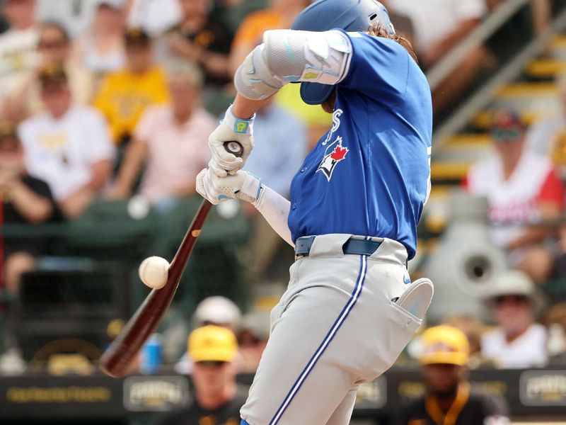 Mar 5, 2024; Bradenton, Florida, USA;  Toronto Blue Jays shortstop Bo Bichette (11) breaks his bat while he swings during the third inning against the Pittsburgh Pirates at LECOM Park. Mandatory Credit: Kim Klement Neitzel-USA TODAY Sports