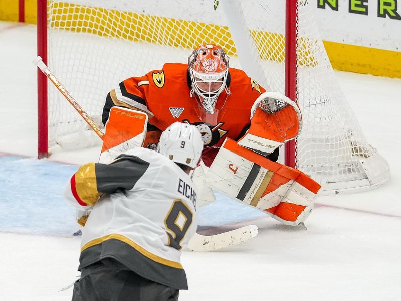 Nov 22, 2025; Anaheim, California, USA; Vegas Golden Knights center Jack Eichel (9) takes a slapshot against Anaheim Ducks goaltender Lukas Dostal (1) during the second period at Honda Center. Mandatory Credit: Corinne Votaw-Imagn Images