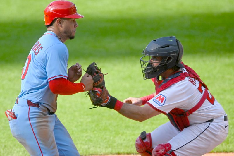 Jun 28, 2025; Cleveland, Ohio, USA; St. Louis Cardinals first baseman Willson Contreras (40) is tagged out by Cleveland Guardians catcher Austin Hedges (27)(right) in the seventh inning at Progressive Field. Mandatory Credit: David Richard-Imagn Images