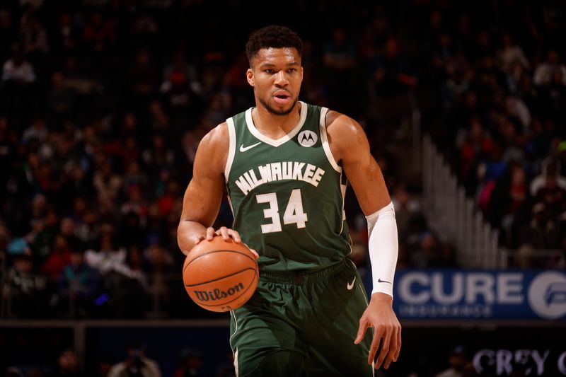 DETROIT, MI - JANUARY 22:  Giannis Antetokounmpo #34 of the Milwaukee Bucks handles the ball during the game against the Detroit Pistons on January 22, 2024 at Little Caesars Arena in Detroit, Michigan. NOTE TO USER: User expressly acknowledges and agrees that, by downloading and/or using this photograph, User is consenting to the terms and conditions of the Getty Images License Agreement. Mandatory Copyright Notice: Copyright 2024 NBAE (Photo by Brian Sevald/NBAE via Getty Images)