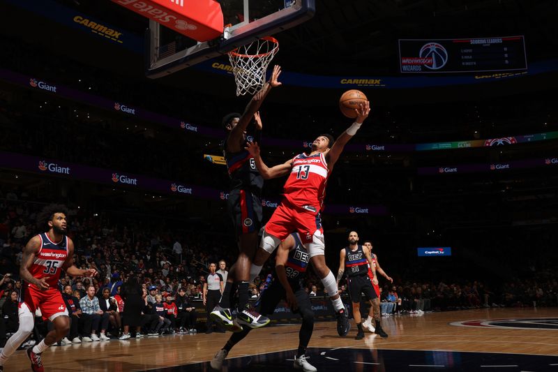 WASHINGTON, DC -? MARCH 29:  Jordan Poole #13 of the Washington Wizards goes to the basket during the game on March 29, 2024 at Capital One Arena in Washington, DC. NOTE TO USER: User expressly acknowledges and agrees that, by downloading and or using this Photograph, user is consenting to the terms and conditions of the Getty Images License Agreement. Mandatory Copyright Notice: Copyright 2024 NBAE (Photo by Stephen Gosling/NBAE via Getty Images)