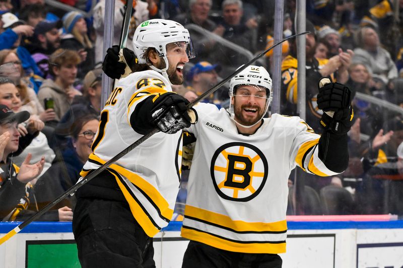 Dec 9, 2025; St. Louis, Missouri, USA; Boston Bruins center Mark Kastelic (47) celebrates with center Marat Khusnutdinov (92) after scoring against the St. Louis Blues during the third period at Enterprise Center. Mandatory Credit: Jeff Curry-Imagn Images