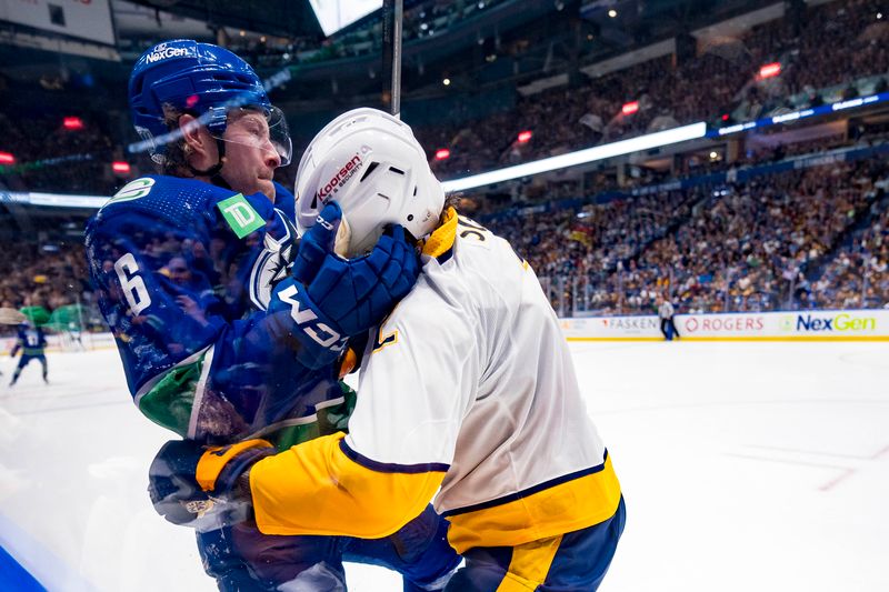 Apr 23, 2024; Vancouver, British Columbia, CAN; Vancouver Canucks forward Brock Boeser (6) battles with Nashville Predators defenseman Luke Schenn (2) during the first period in game two of the first round of the 2024 Stanley Cup Playoffs at Rogers Arena. Mandatory Credit: Bob Frid-USA TODAY Sports