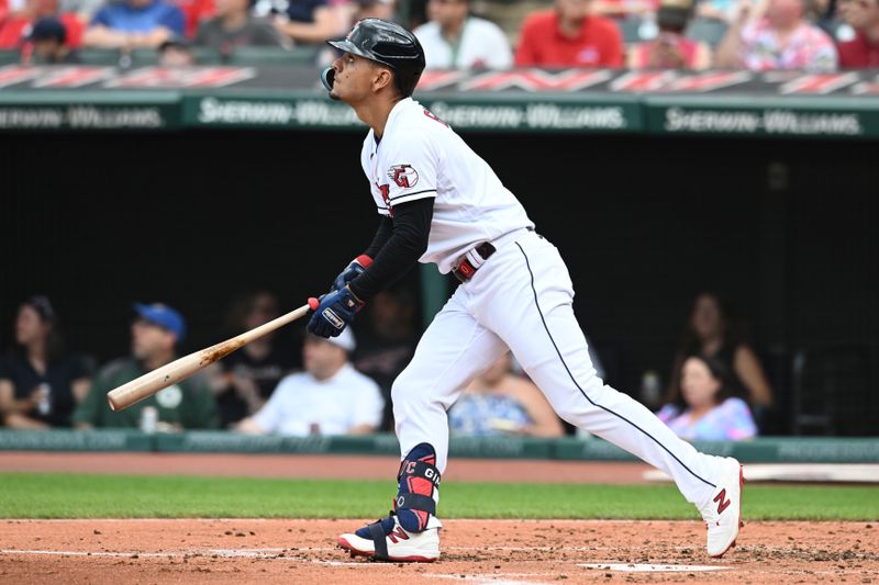 Jul 23, 2023; Cleveland, Ohio, USA; Cleveland Guardians second baseman Andres Gimenez (0) hits a home run during the second inning against the Philadelphia Phillies at Progressive Field. Mandatory Credit: Ken Blaze-USA TODAY Sports